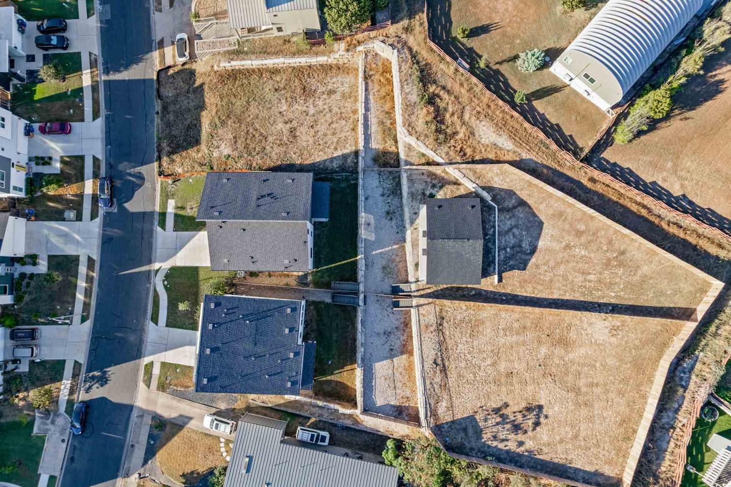 Overhead drone photograph of a residential roof showing its pitch, valleys and vents