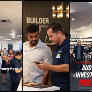 Two attendees talking beside the signage at an Austin investment meetup