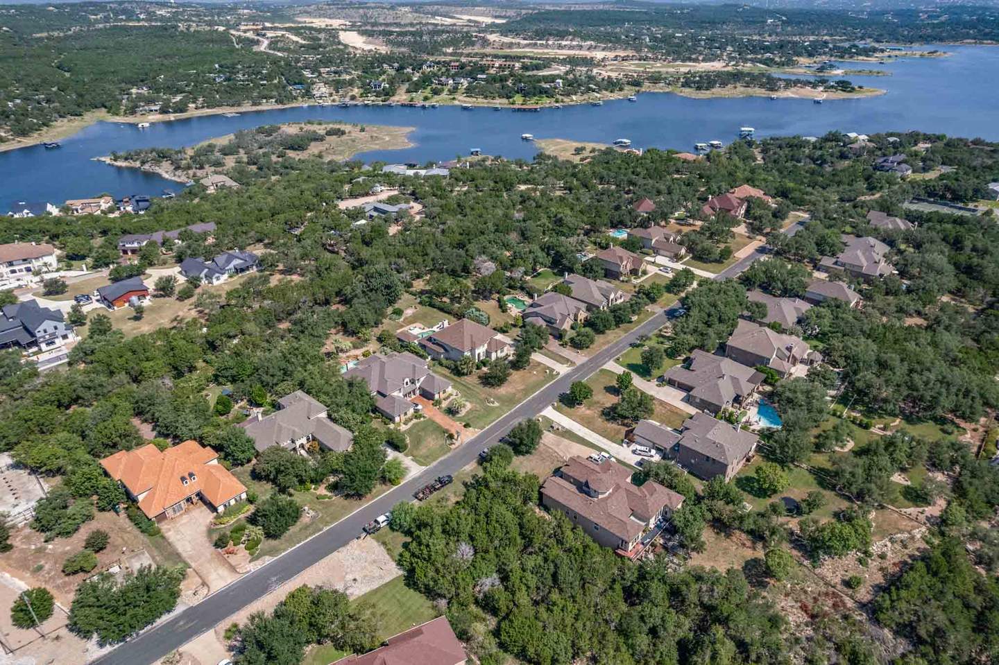 Aerial photograph over Lake Travis showing waterfront property and the shoreline