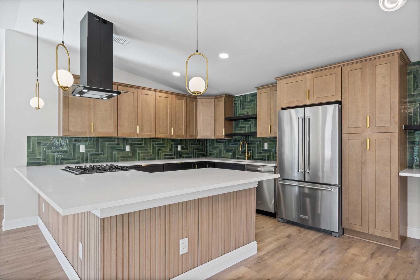 New build kitchen in South Austin with wood cabinetry, a green tile splashback and a white island
