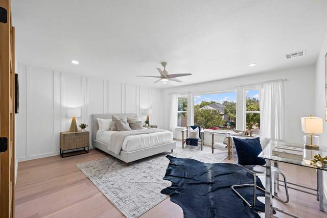 Primary bedroom in South Austin with a vaulted ceiling and a bench at the foot of the bed