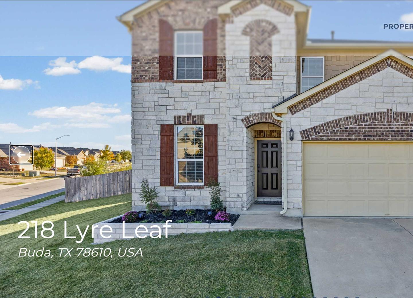 Single property website showing a listing exterior with the address overlaid on the photograph