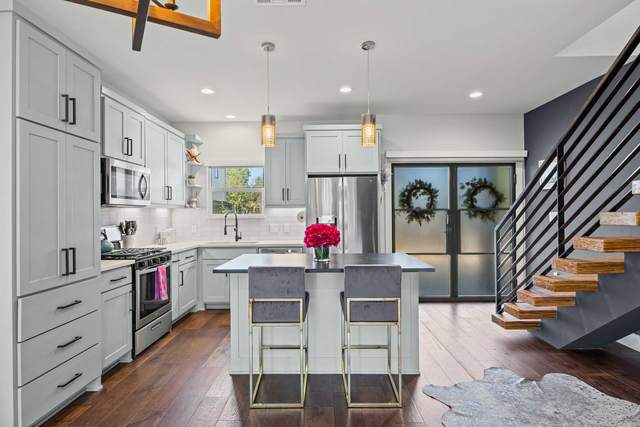 Short term rental kitchen in South Austin with a white island and bar stools